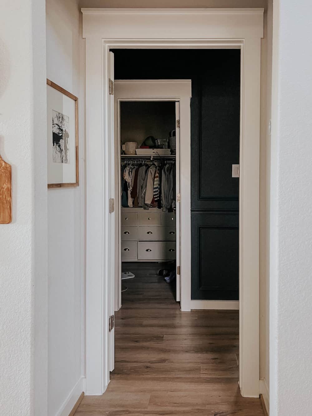 view of a messy closet from a hallway 