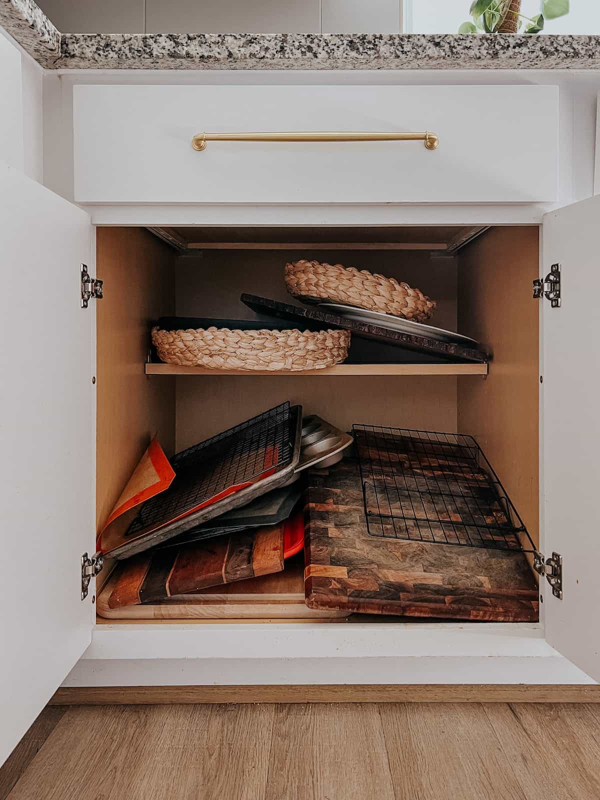 cookie sheet and cutting board cabinet with no organization