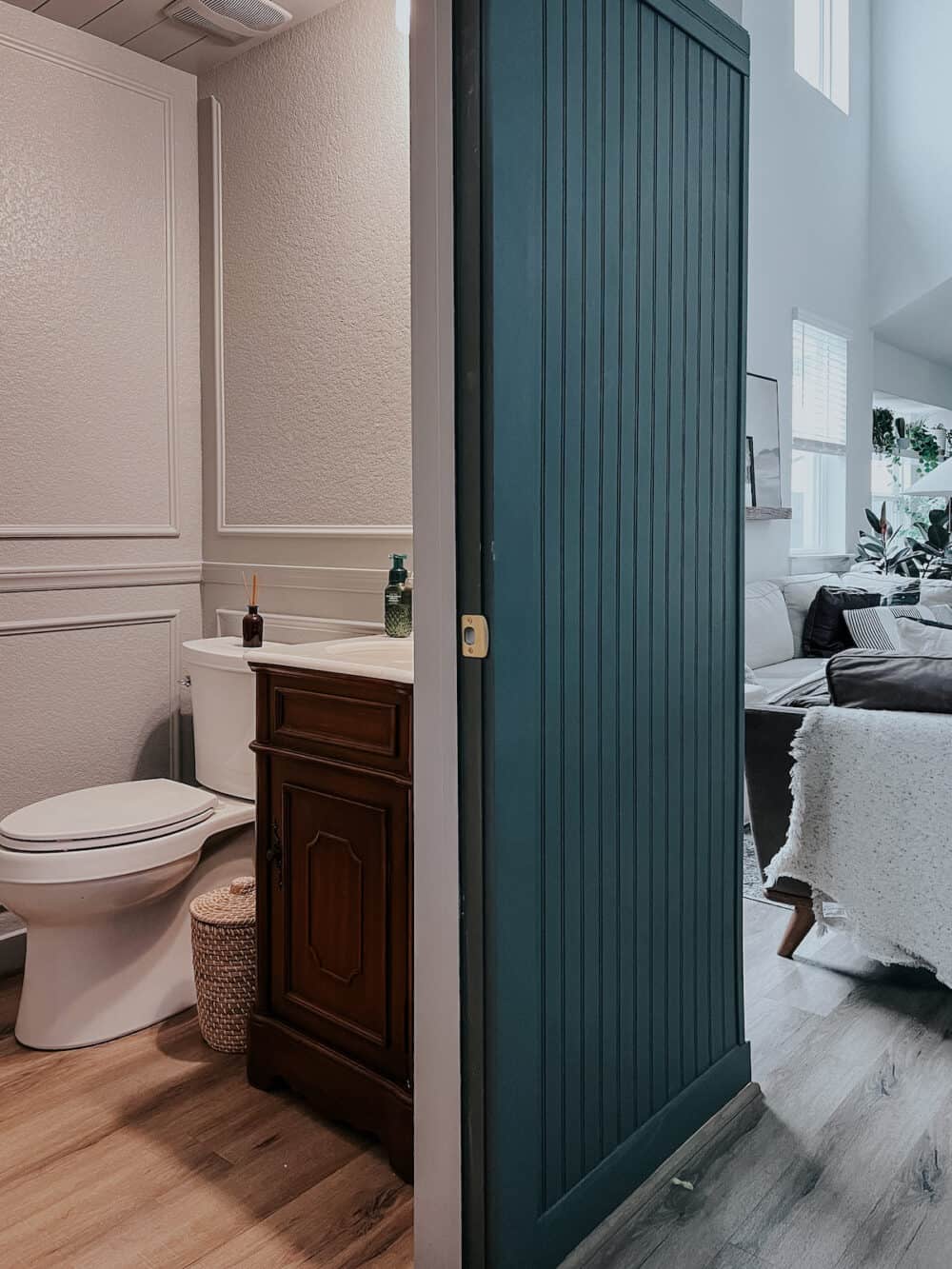 view of a small powder room under a staircase 