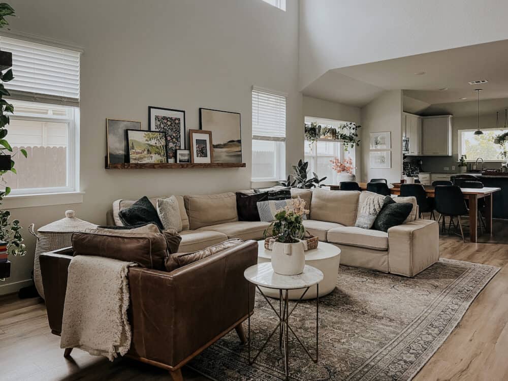 Living room with neutral colors, a leather chair, and a white IKEA sofa 