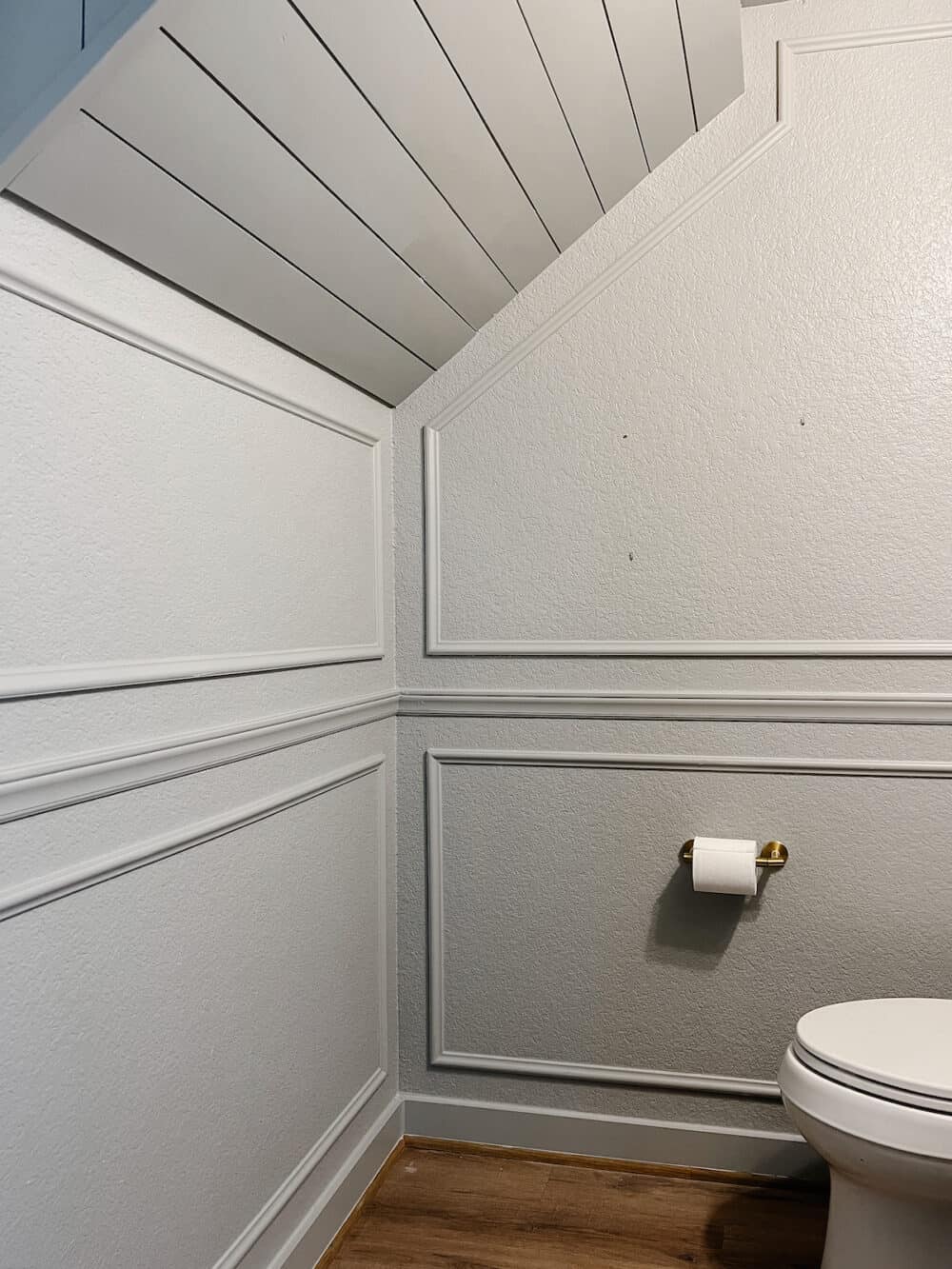 Small powder room with a shiplap ceiling 