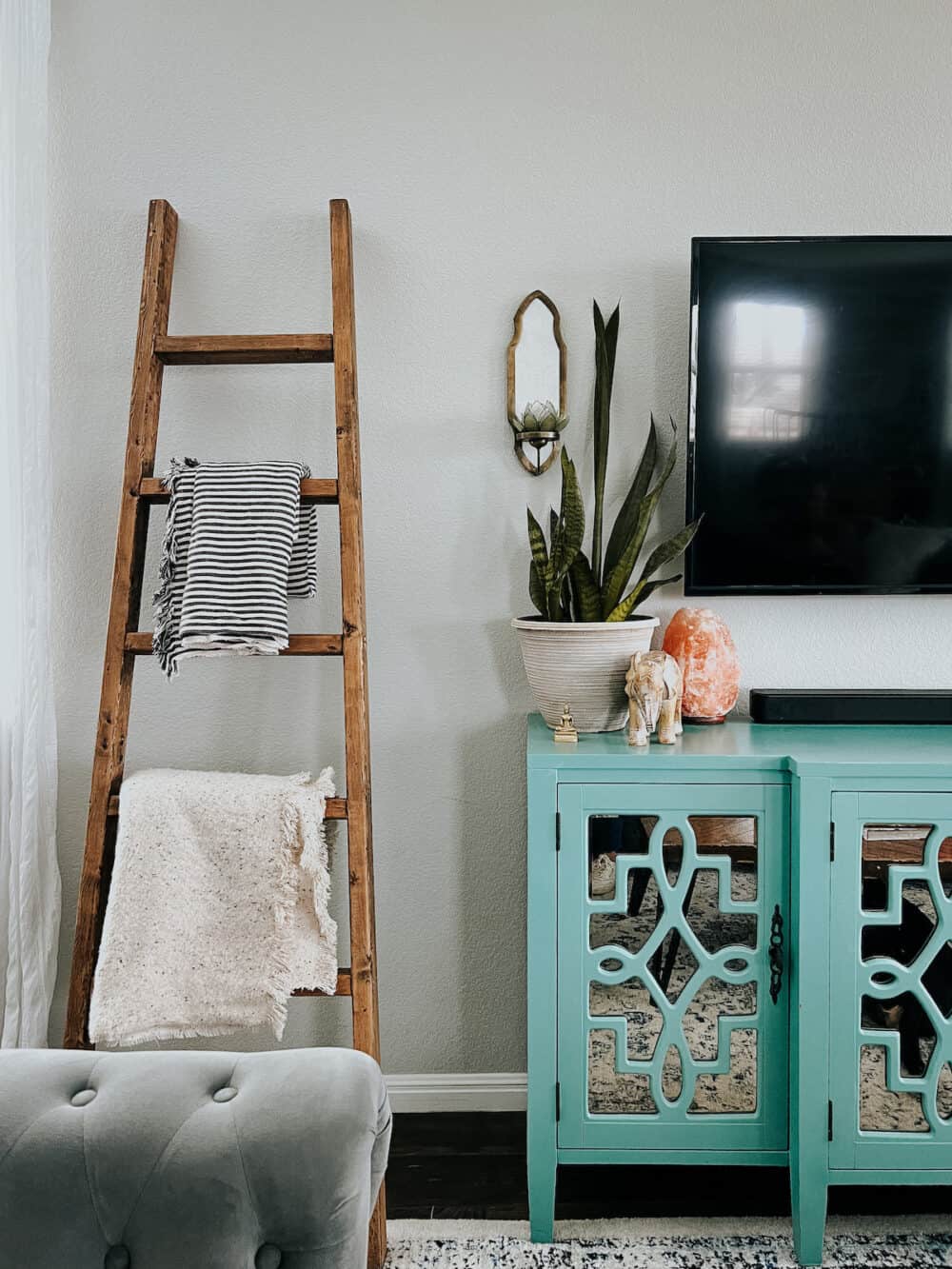 colorful living room with a wooden blanket ladder 