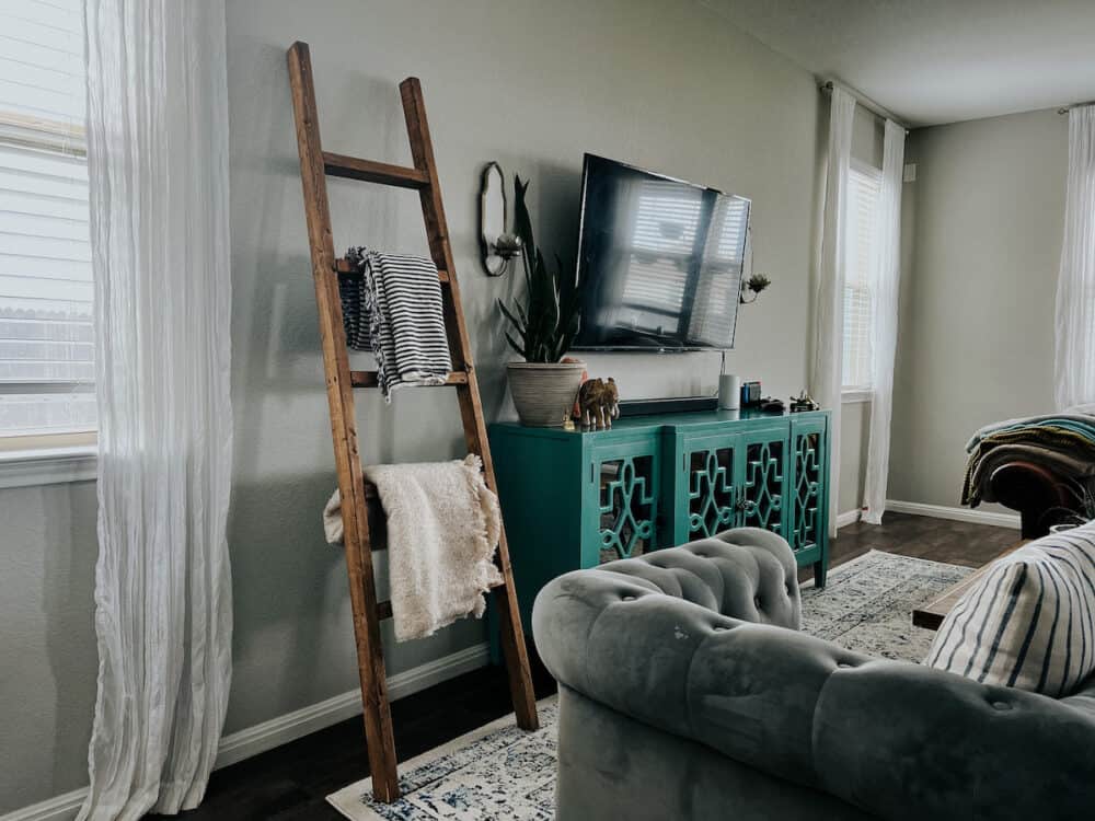 blanket ladder with blankets on it in a living room 