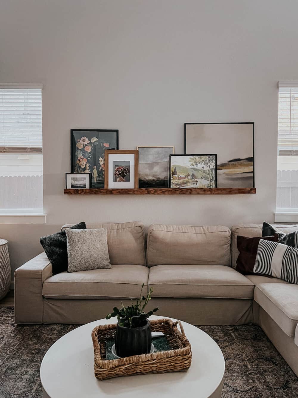 sectional sofa with a large picture ledge above it 