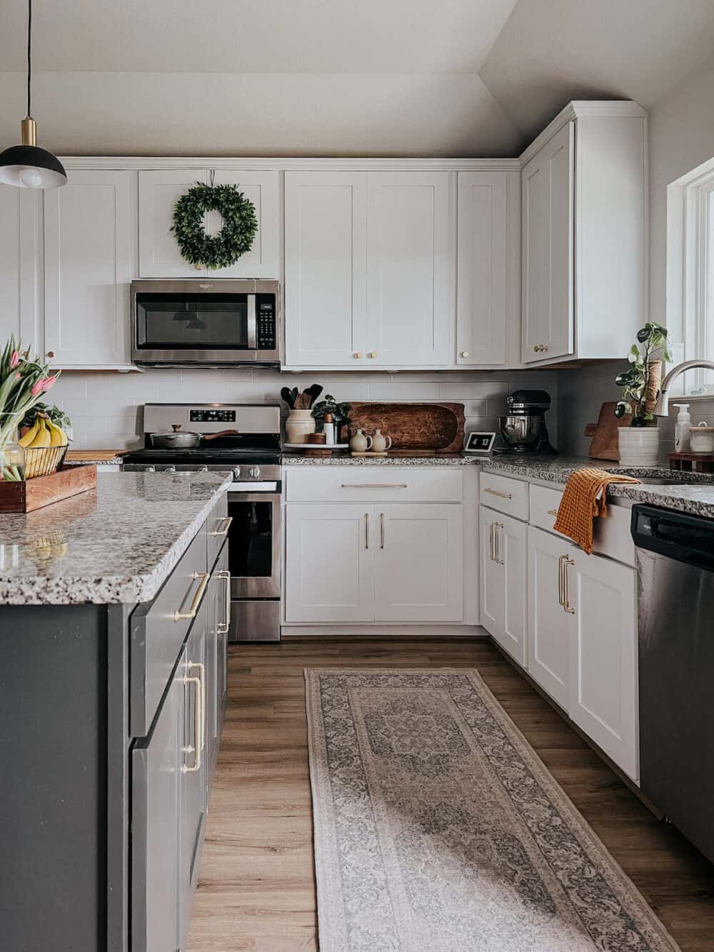 white kitchen with black kitchen island 