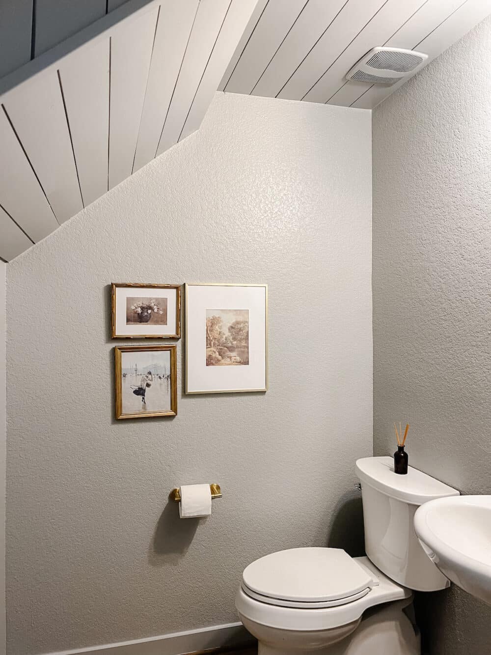 small powder room with a shiplap ceiling 