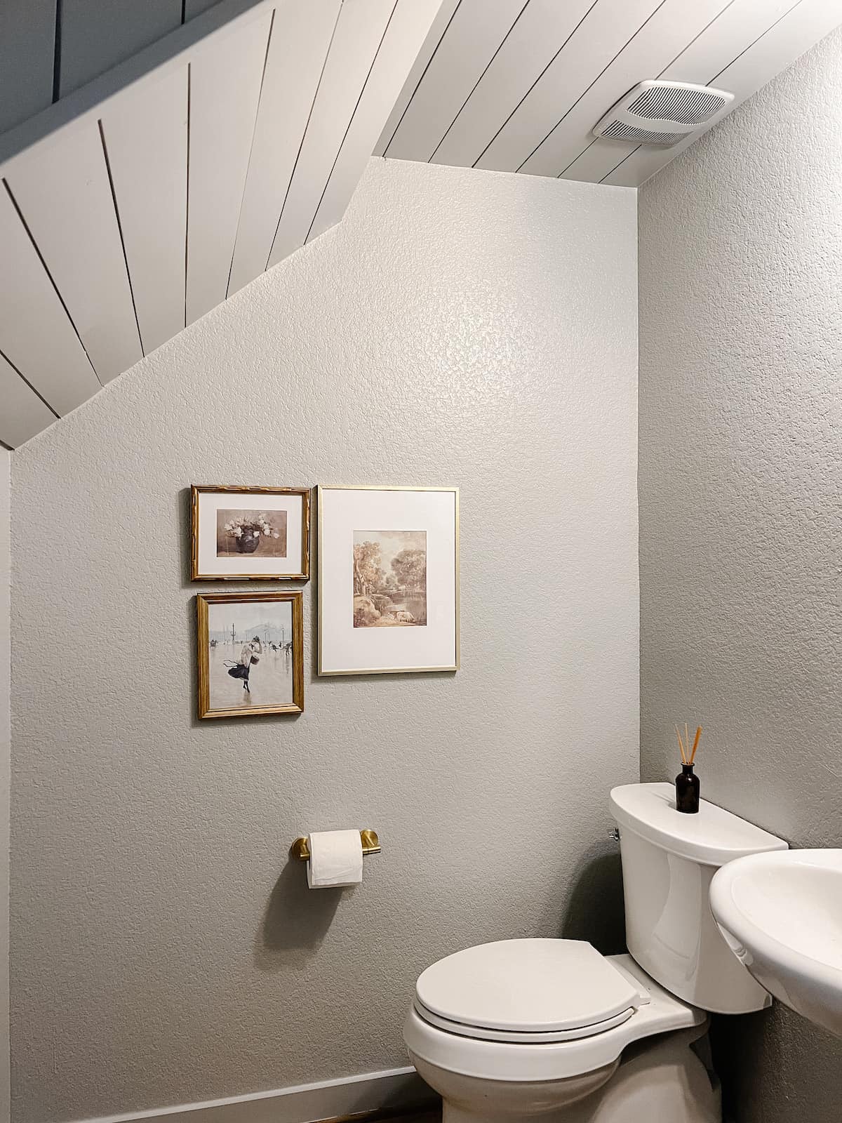 small powder room with a shiplap ceiling