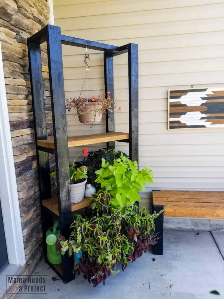 front porch with a plant shelf with hanging plant