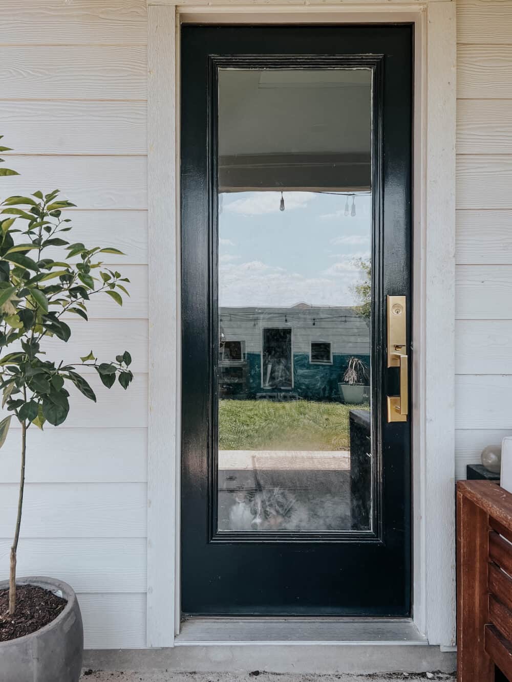 back door painted with Sherwin Williams Tricorn Black 