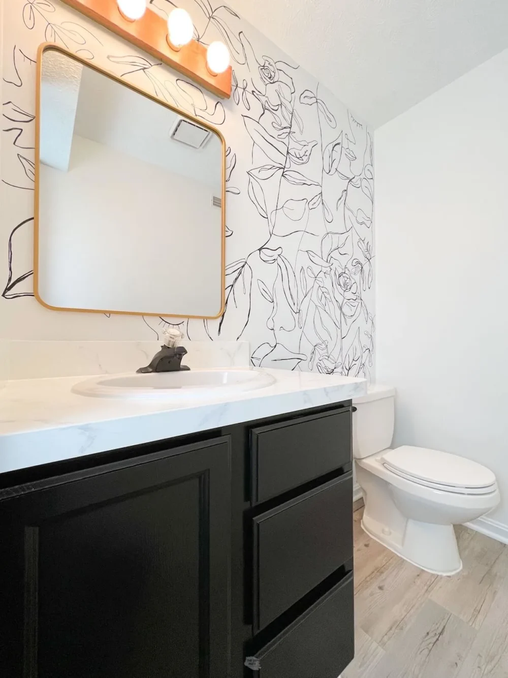 bathroom with small vanity painted tricorn black