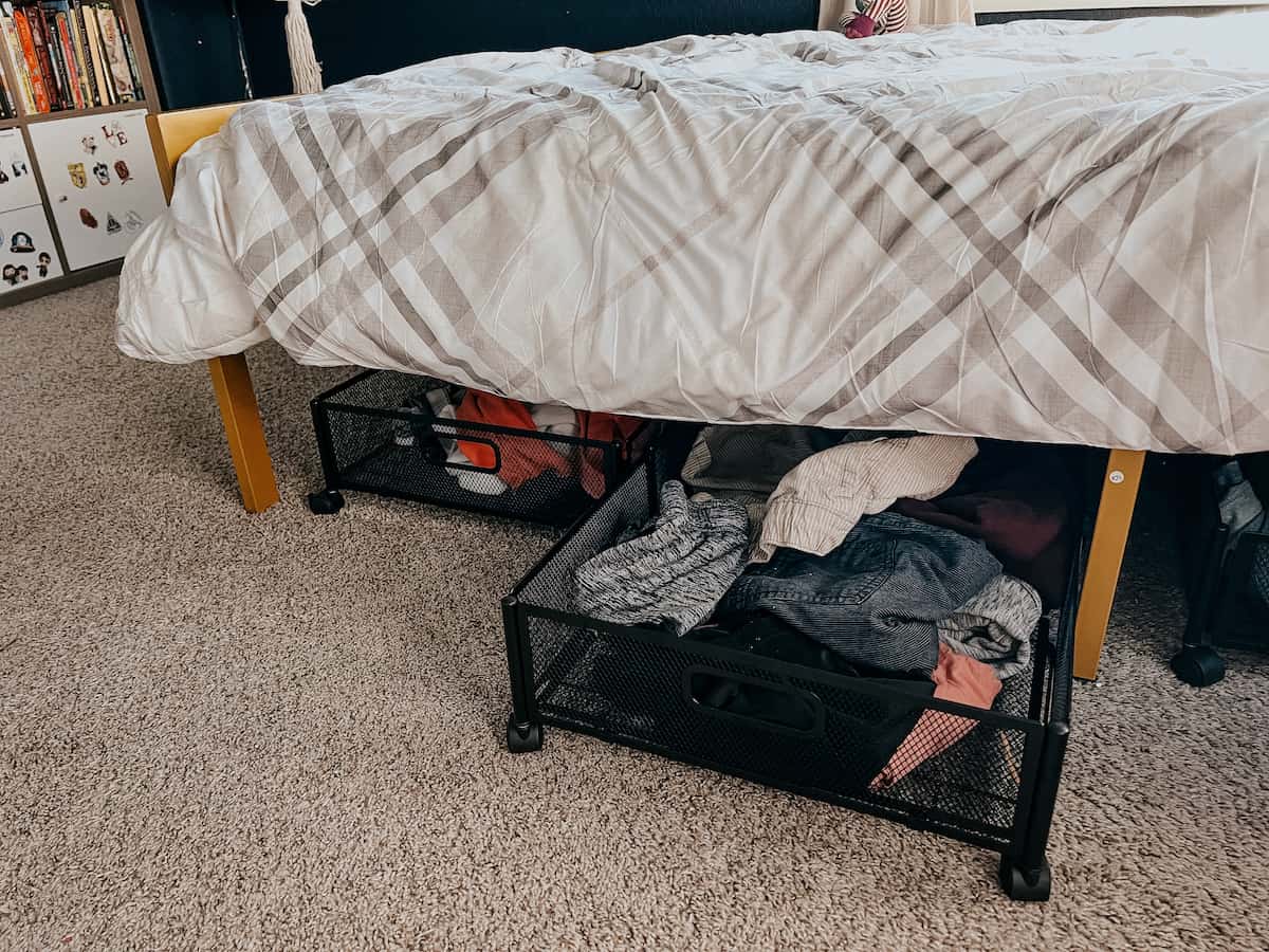 kid room with pull out drawers underneath bed 
