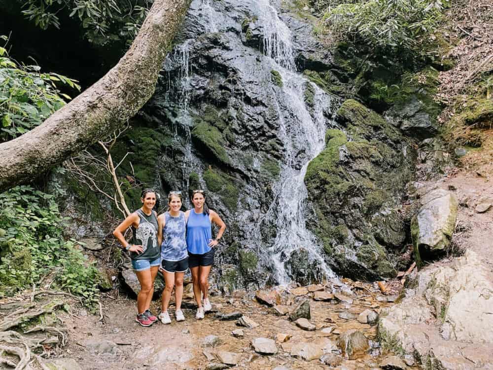 three women posing in the Rocky Mountains