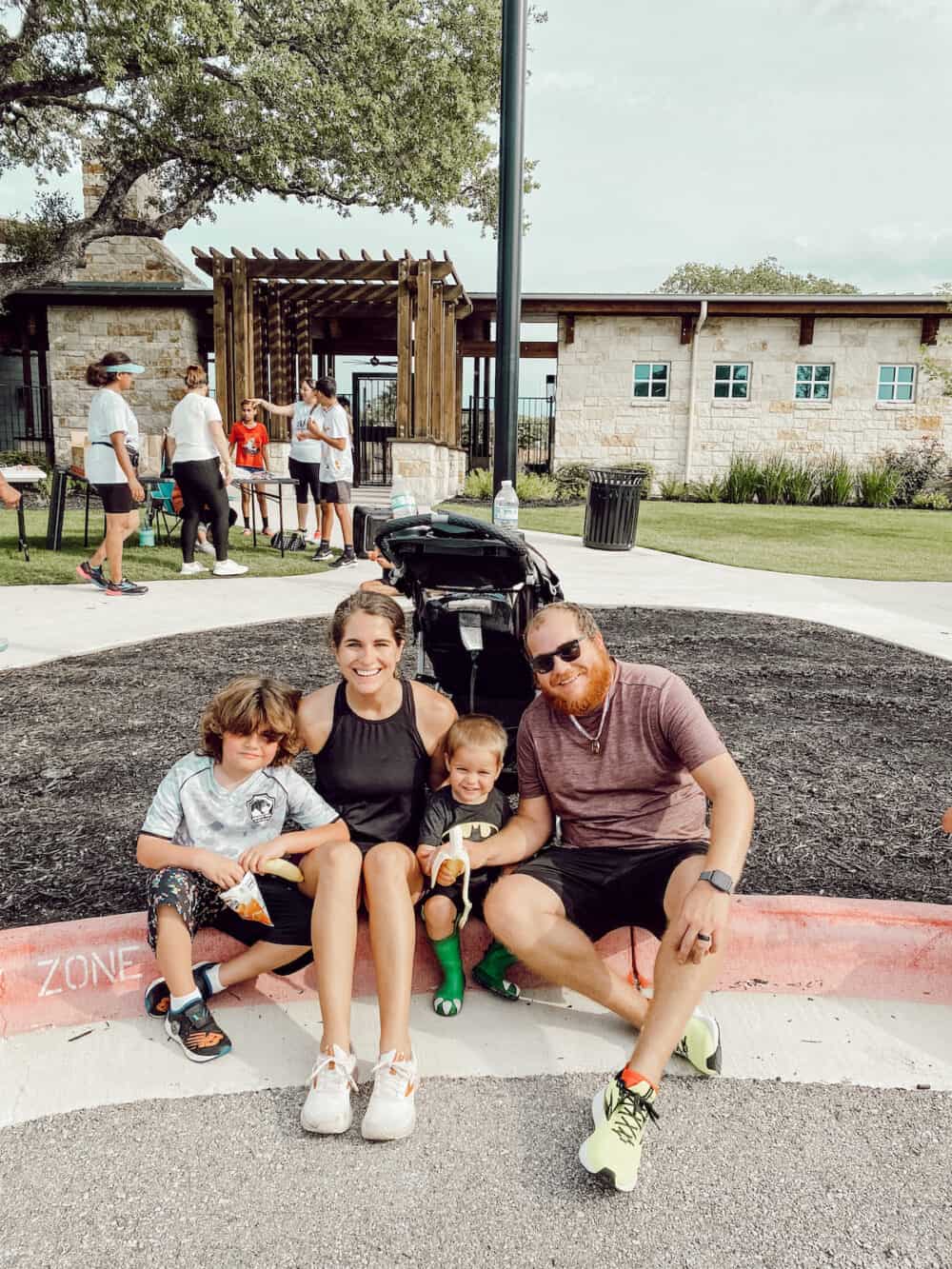 woman posing with her family after running a 5k