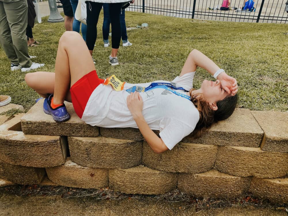 woman resting after running a marathon