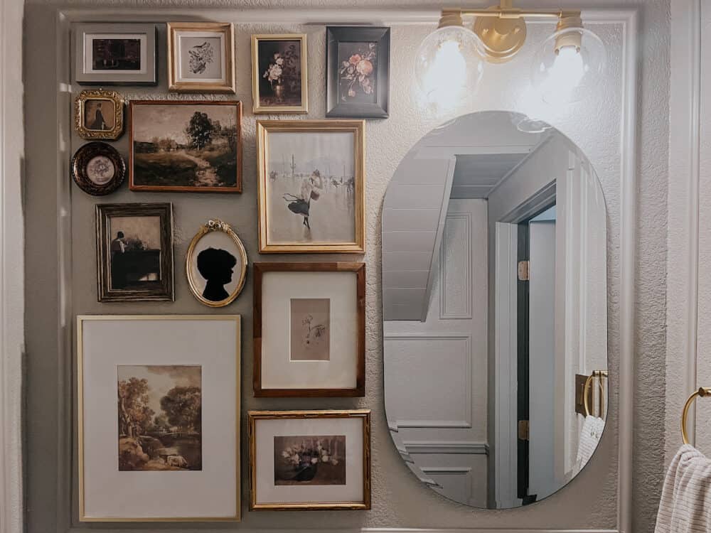 powder room with large gallery walll
