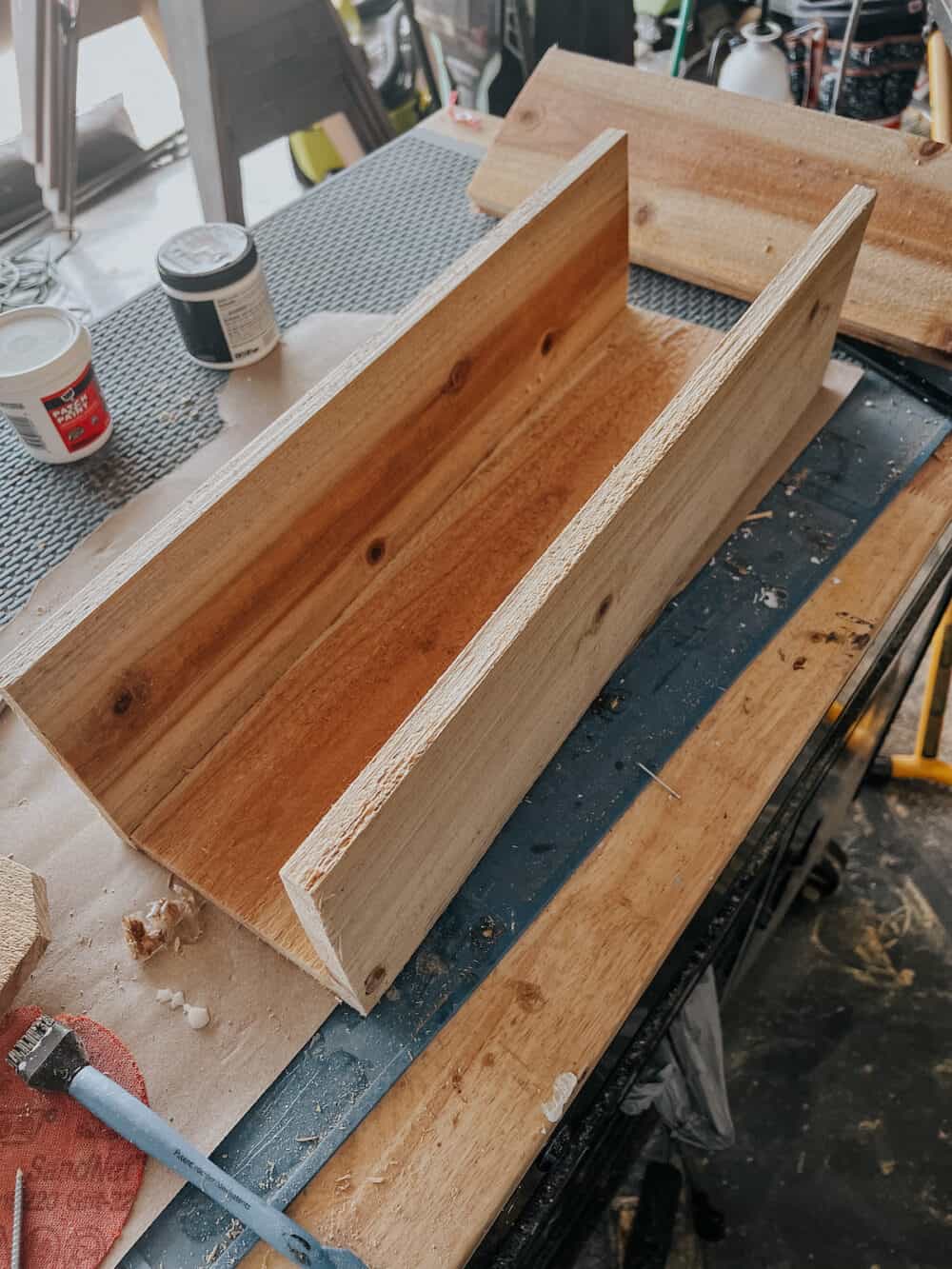 Partially assembled window box made of cedar fence pickets 