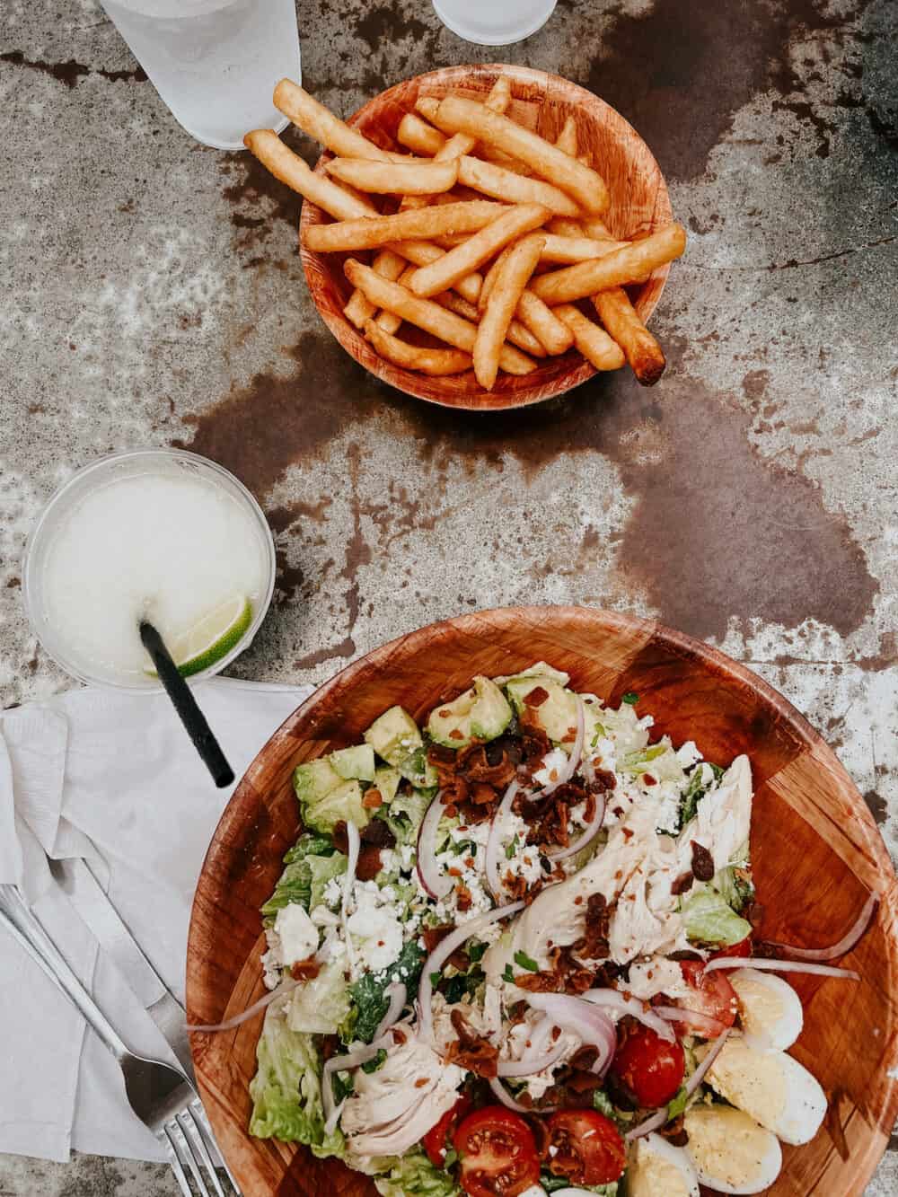 salad and french fries from Lou's in Austin