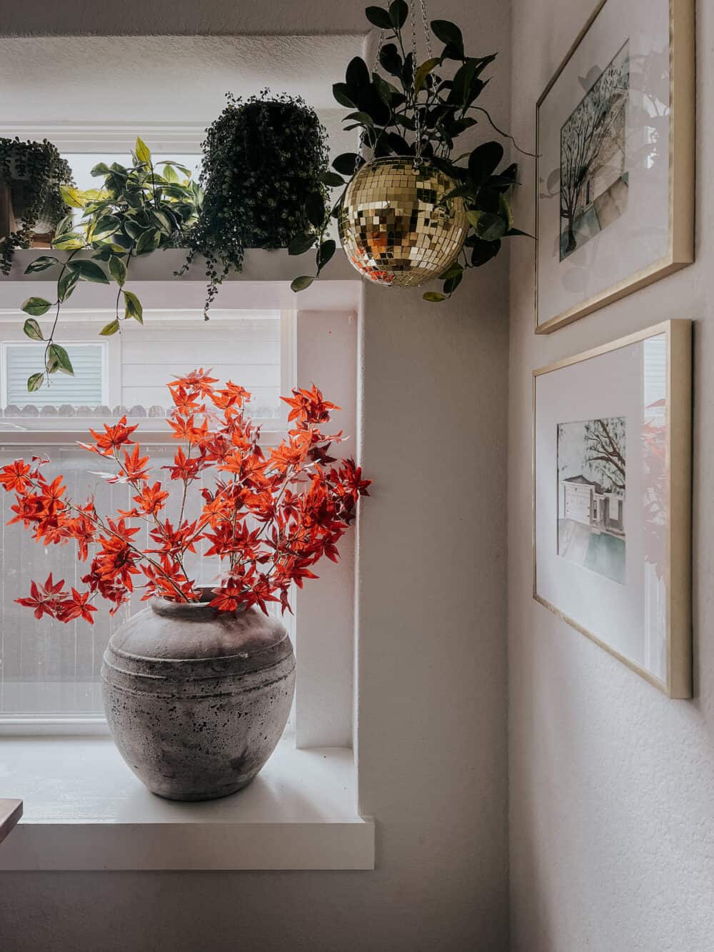 corner of a dining room with faux fall stems