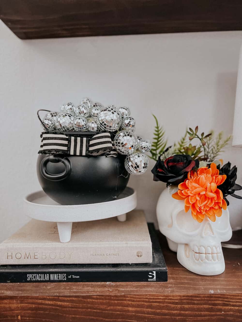 Easy Halloween decoration idea - a DIY witch's cauldron filled with disco balls 