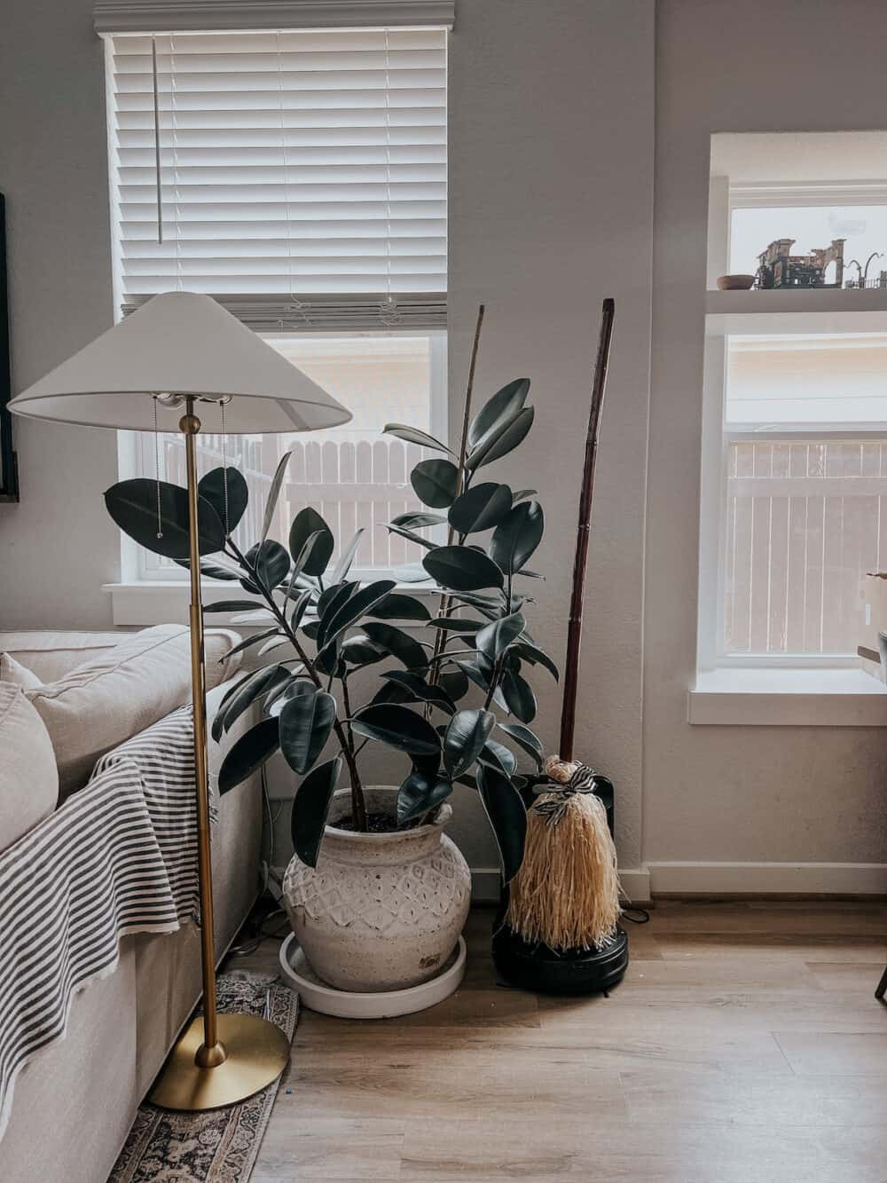 faux broom attached to a robot vacuum 