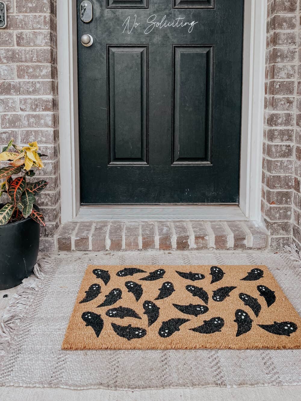 a ghost door mat for halloween 