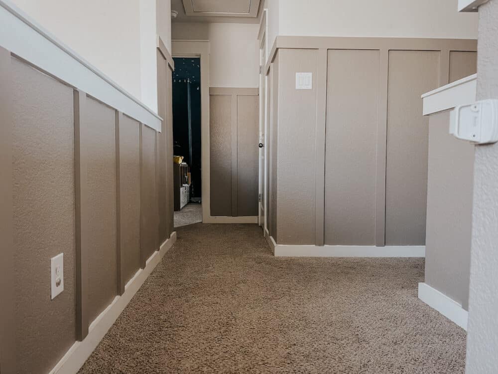 upstairs landing with board and batten wall treatment painted perfect greige