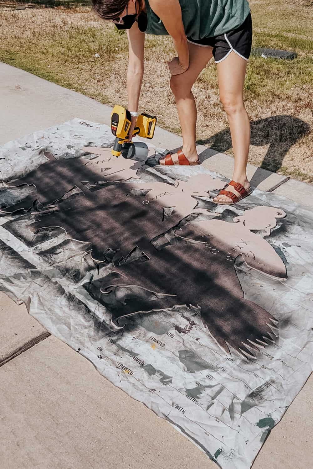 woman painting a DIY halloween decoration 