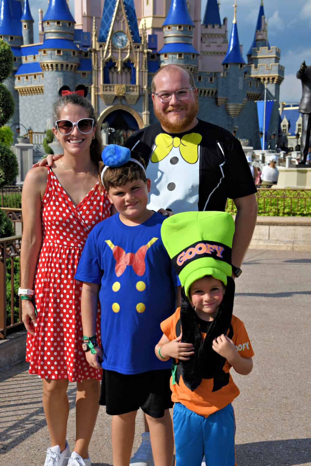 family in costumes at halloween part at Disney world 