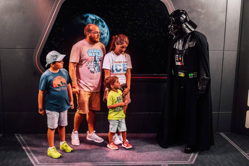 family posing with Darth Vader at Hollywood Studios in Disney World 