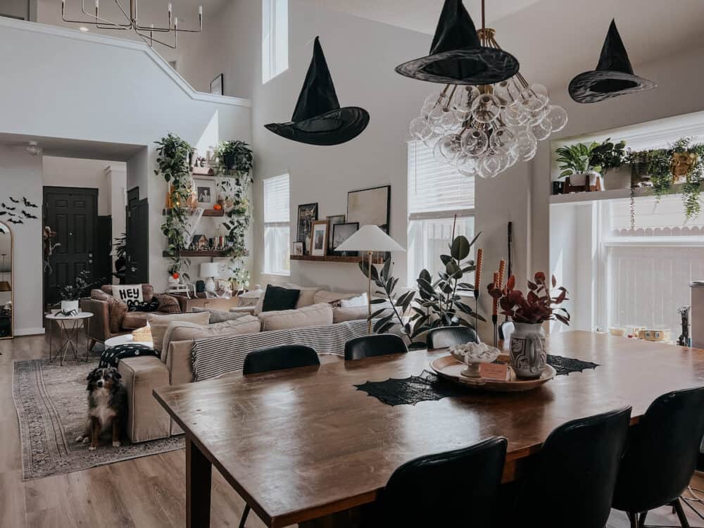 dining room with witch hats hanging from the ceiling