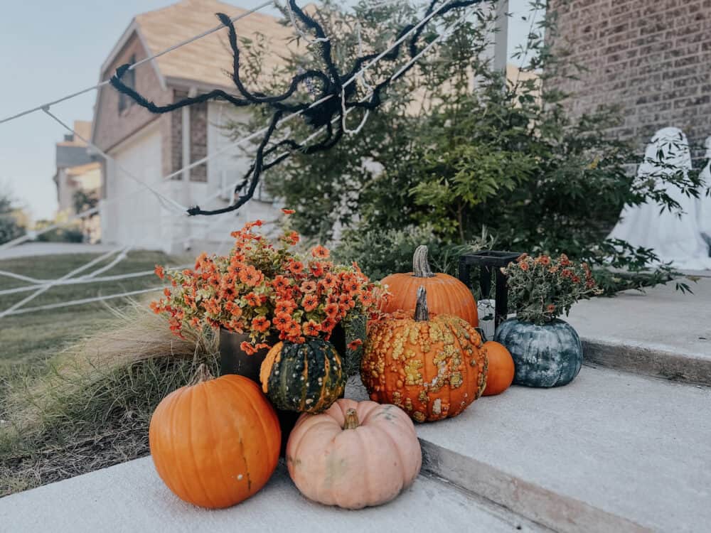 front steps decorated with pumpkins for Halloween