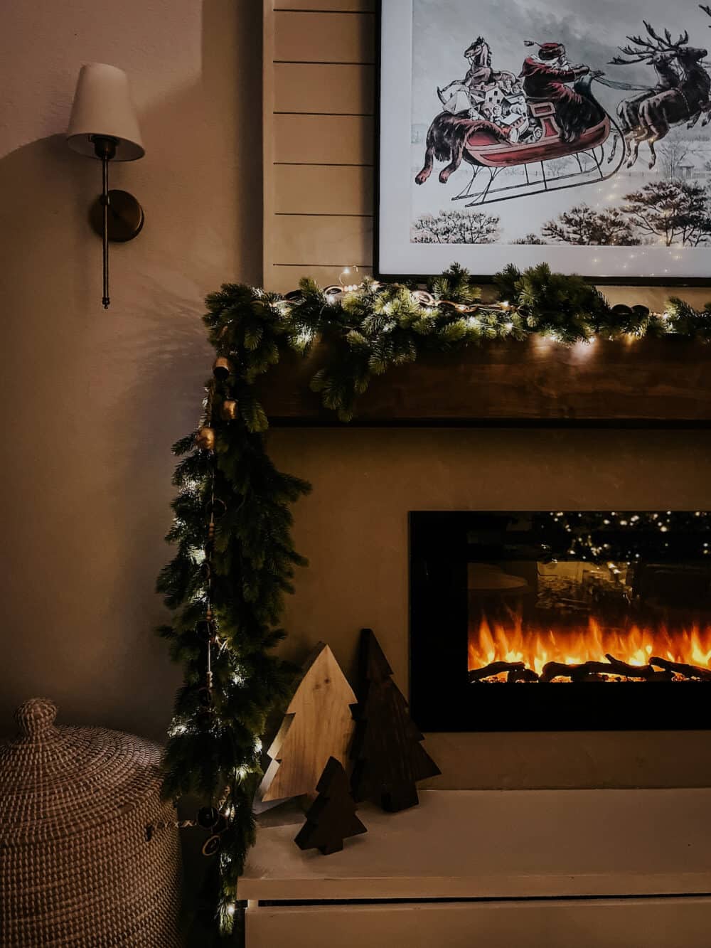 mantel with garland wrapped in twinkle lights