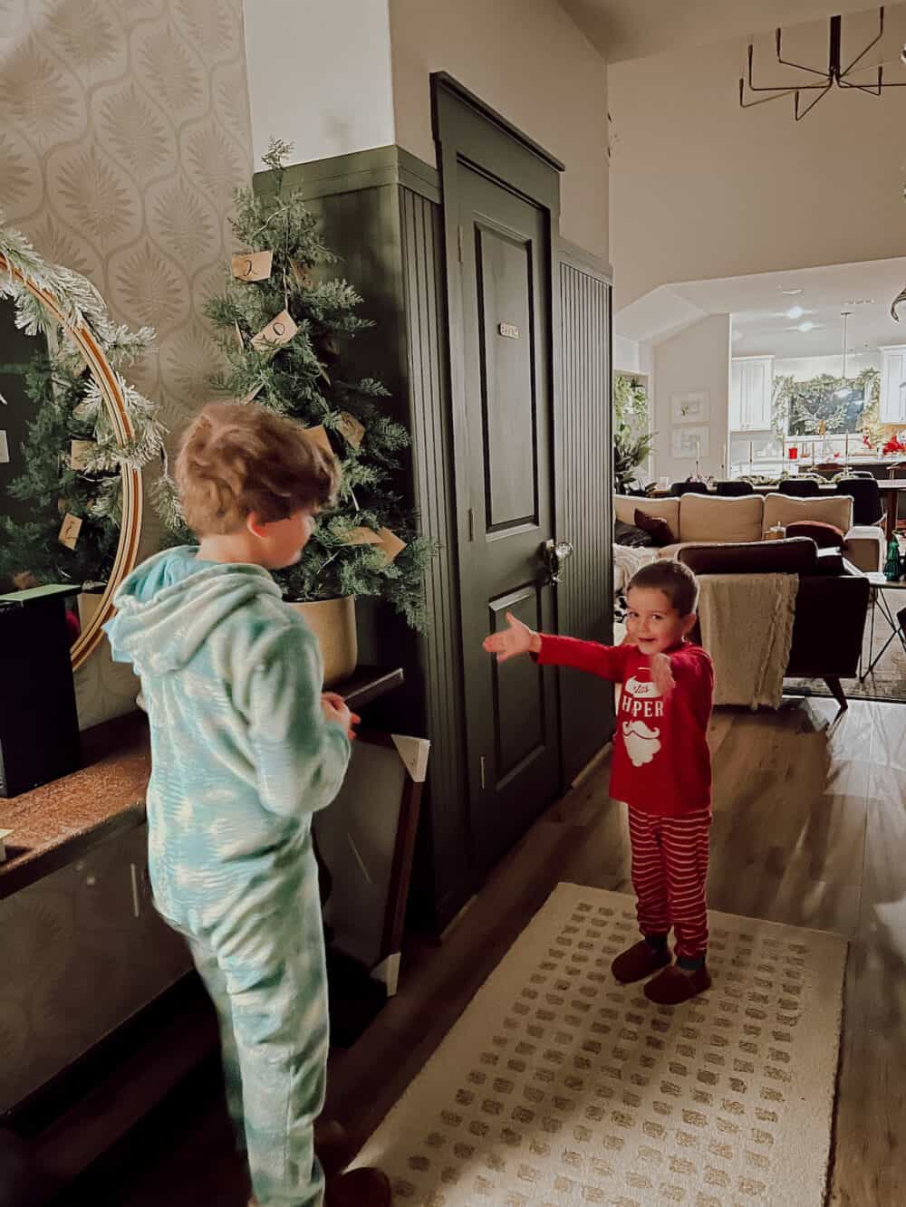 Two boys participating in a christmas scavenger hunt