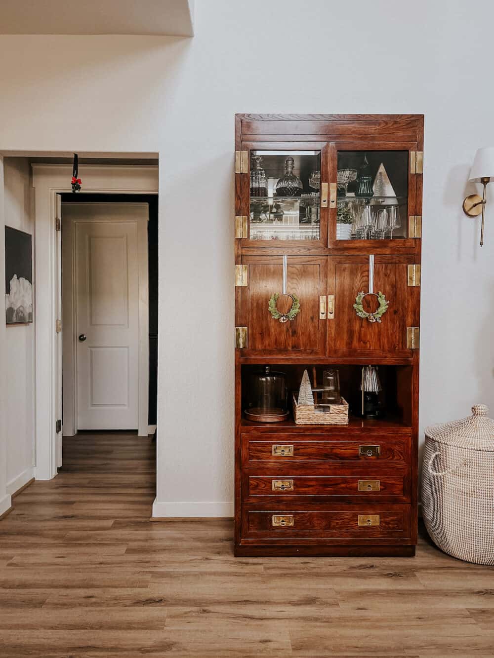 tall vintage cabinet decorated for Christmas