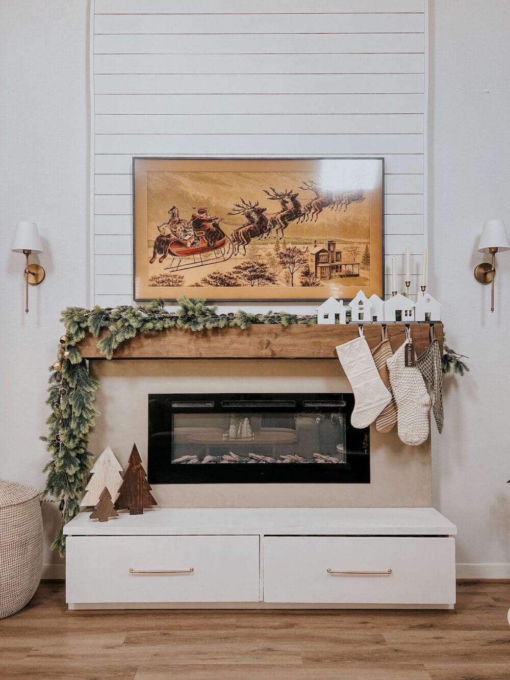 Fireplace decorated for Christmas with DIY wood christmas trees on the hearth