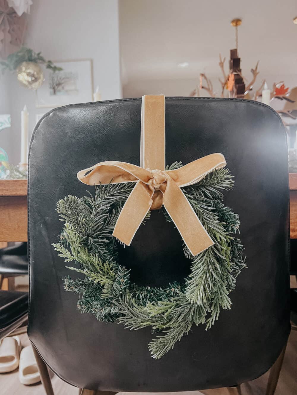 Close up of a wreath on the back of a chair for Christmas 
