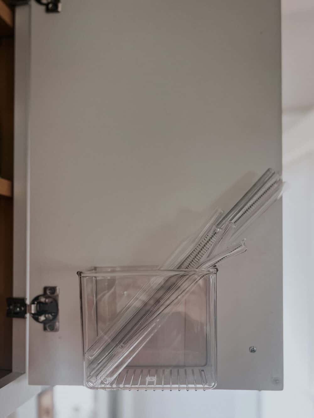 Straw organizer on a cabinet door