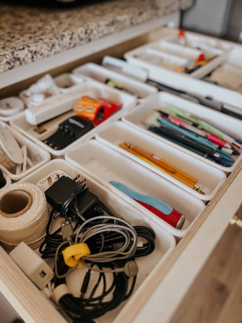 modular junk drawer organizers in a large junk drawer 