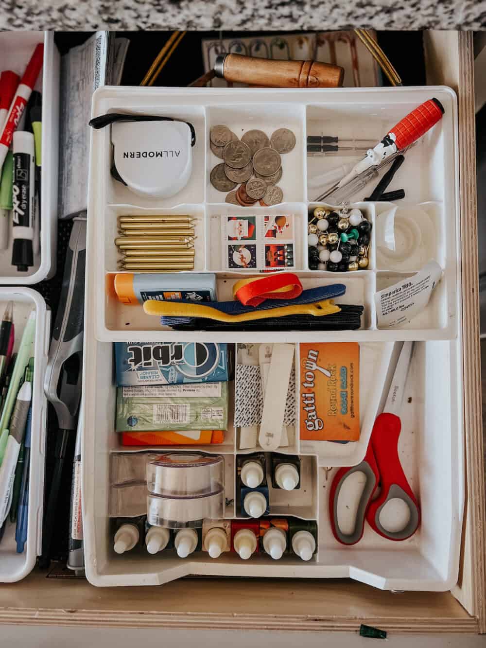 a two tier junk drawer organizer organized in a drawer