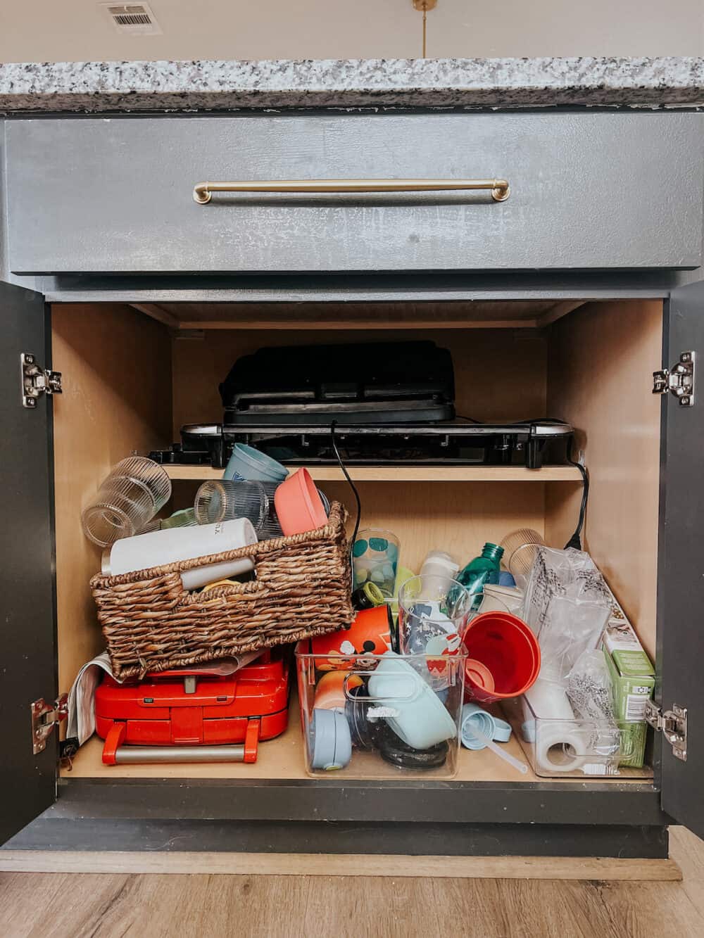 Kid cabinet before organizing