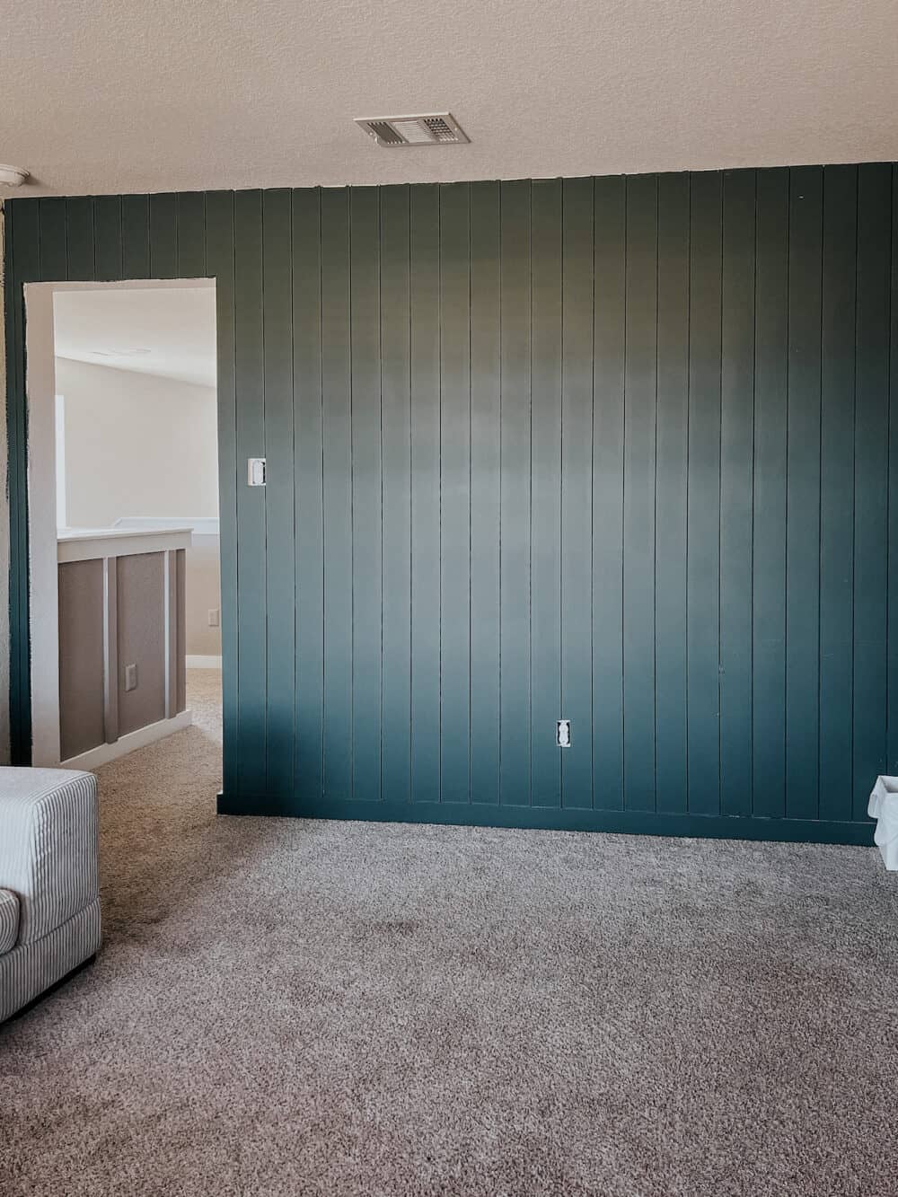 shiplap wall painted dark green 