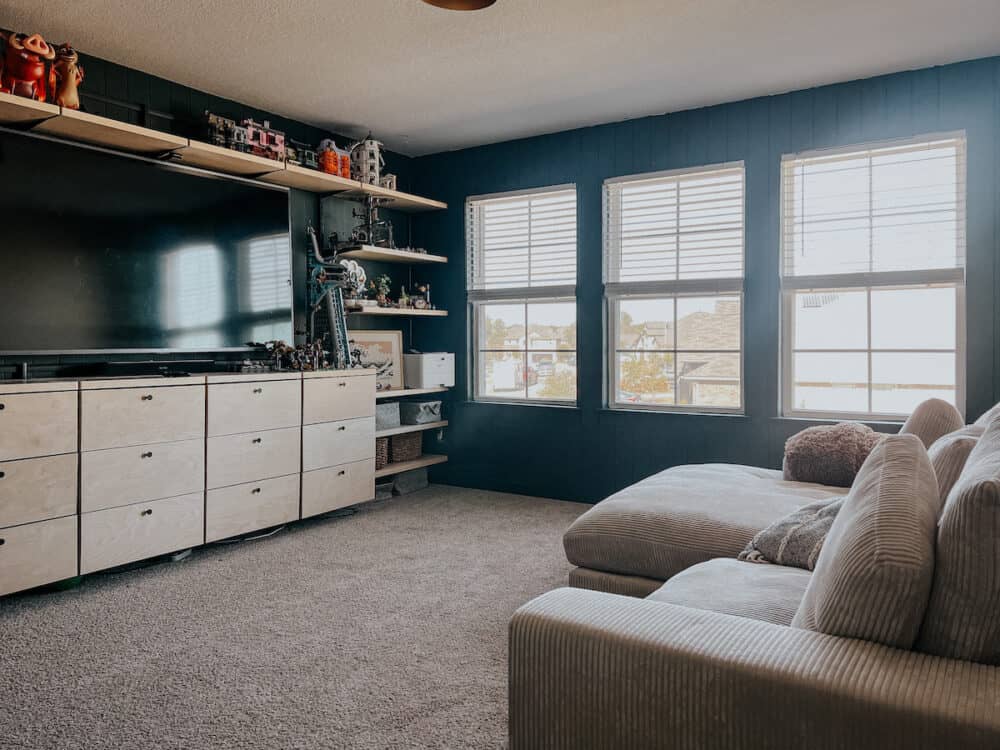 Family room with dark green shiplap