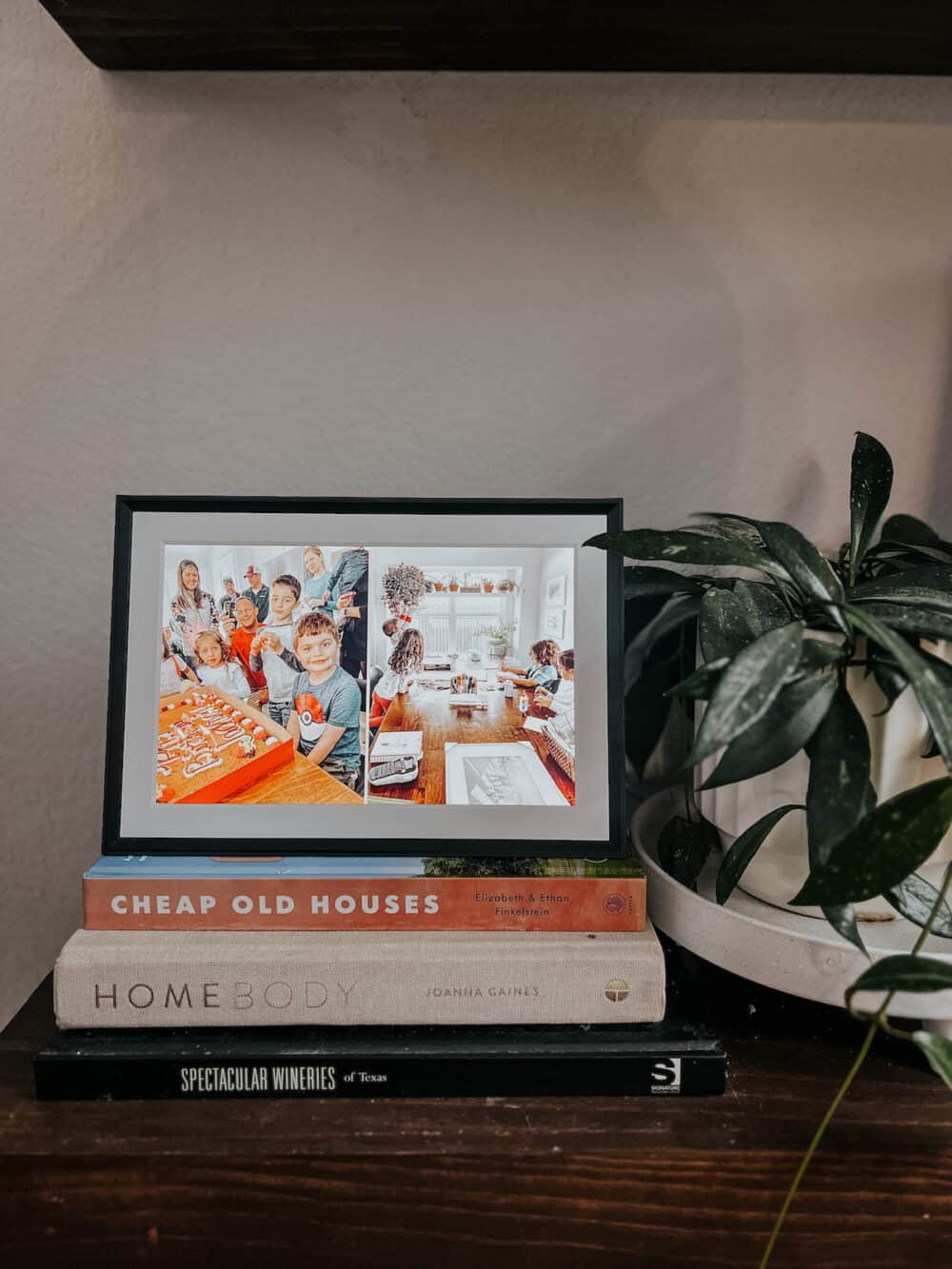 digital photo frame sitting on a shelf 