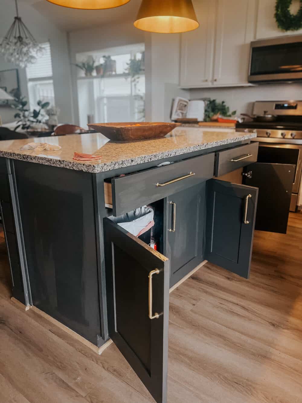 Kitchen cabinets with doors open while drying after being sealed 