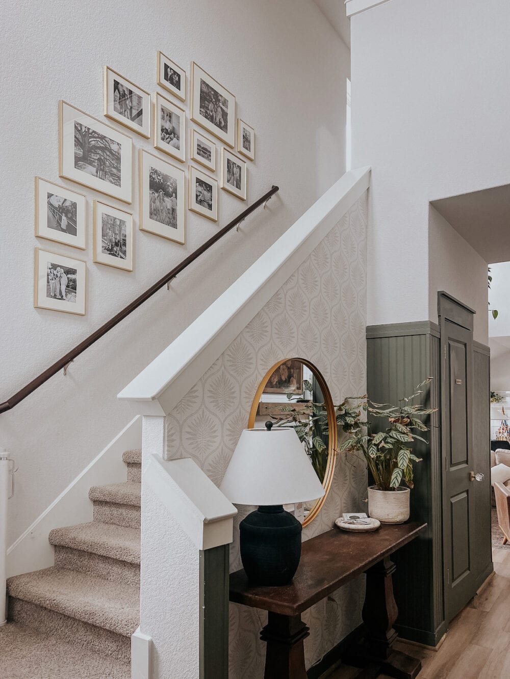 Staircase gallery wall in the entry of a home