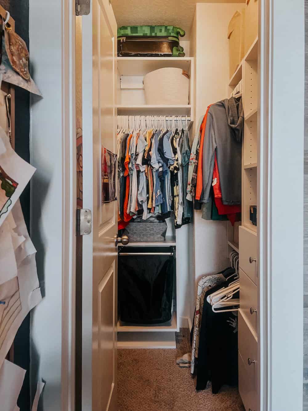 small walk in closet with a closet system 