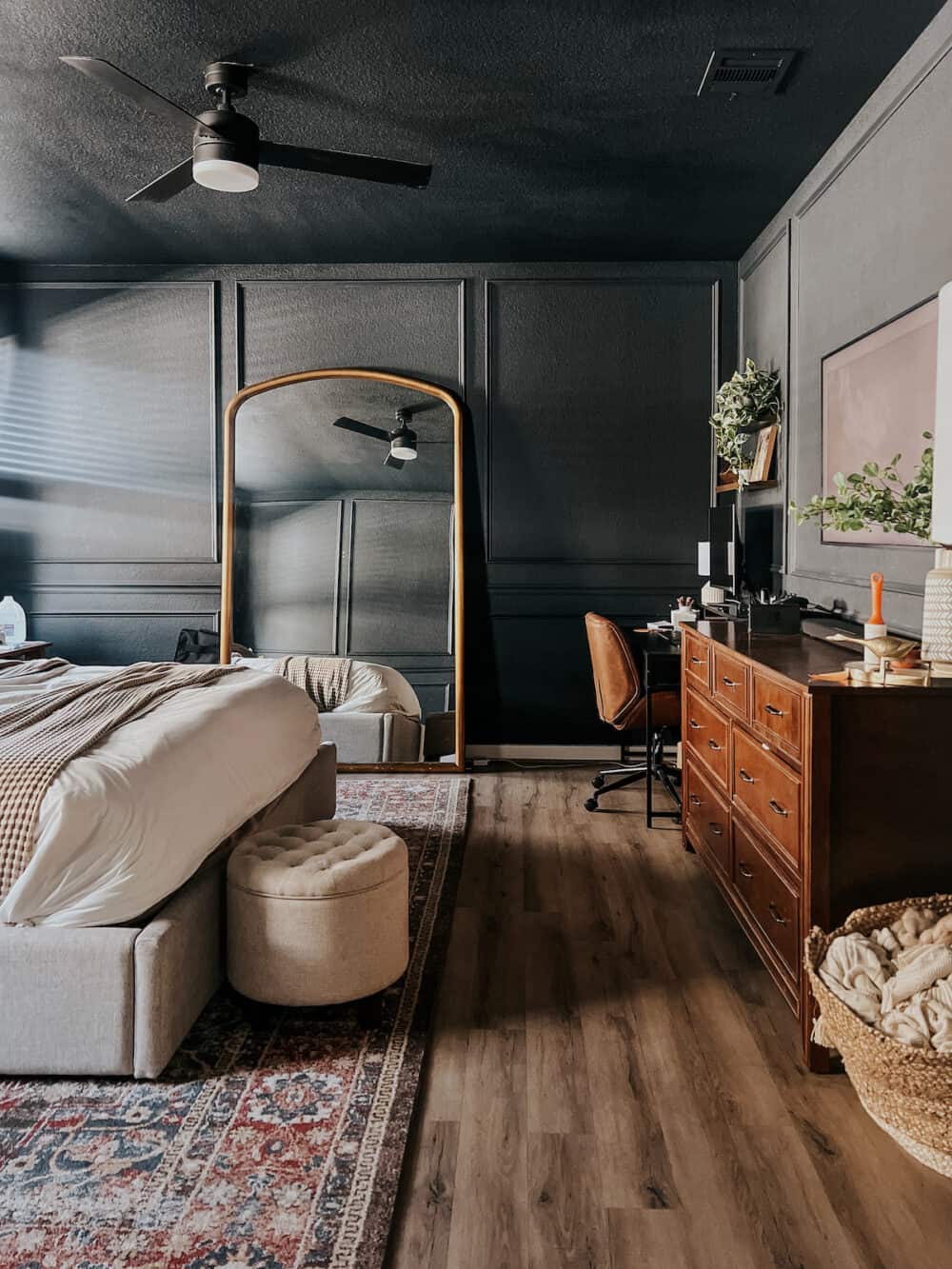 bedroom with ceiling painted the same dark blue color as the walls 