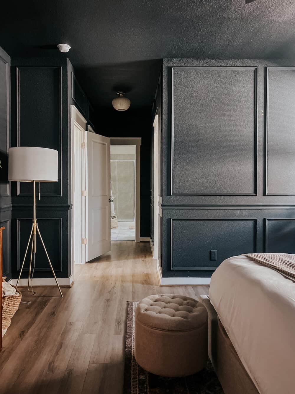 bedroom with dark blue painted walls and ceilings