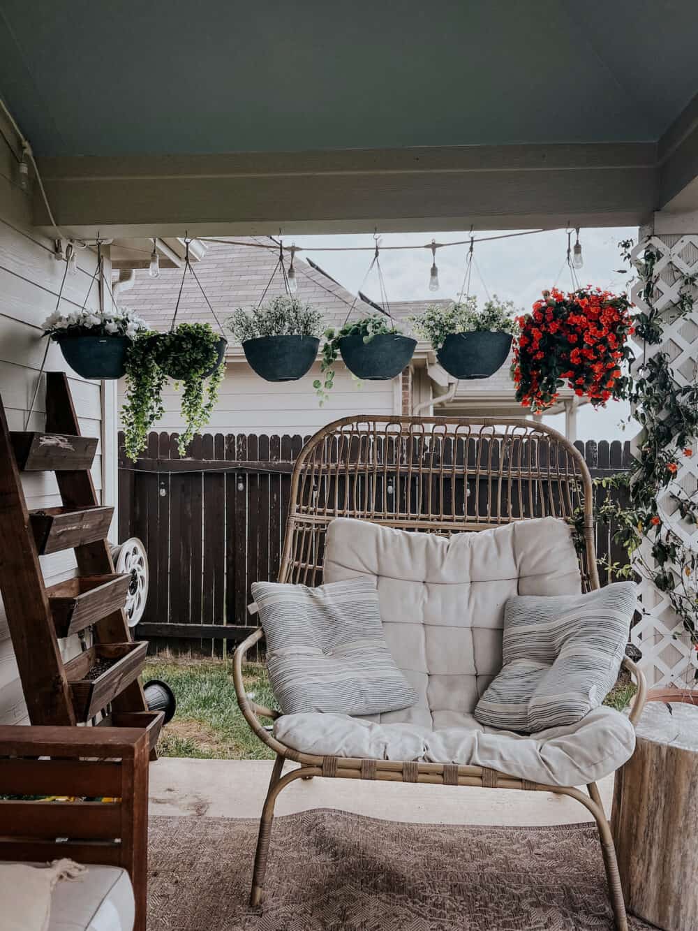 back patio with faux plants in hanging planters 