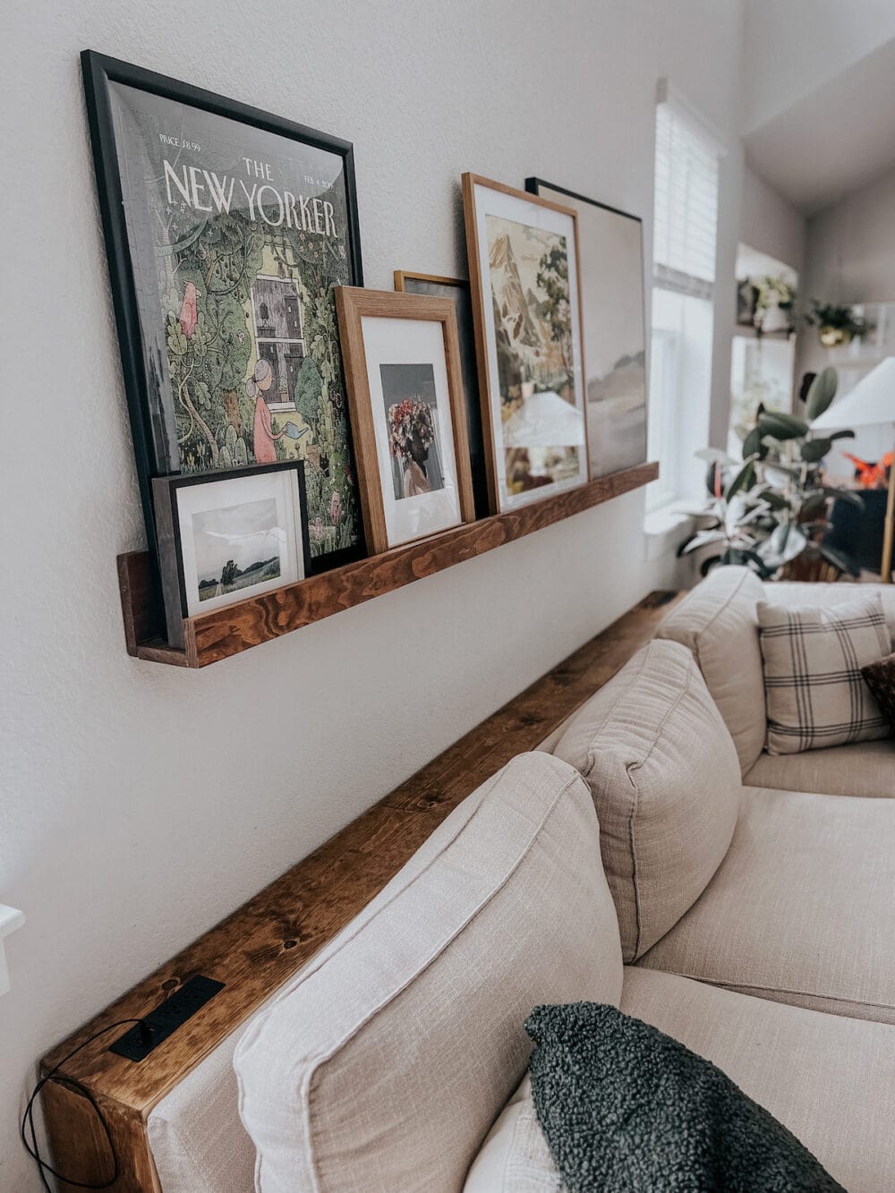 simple DIY sofa table sitting behind a couch next to the wall 